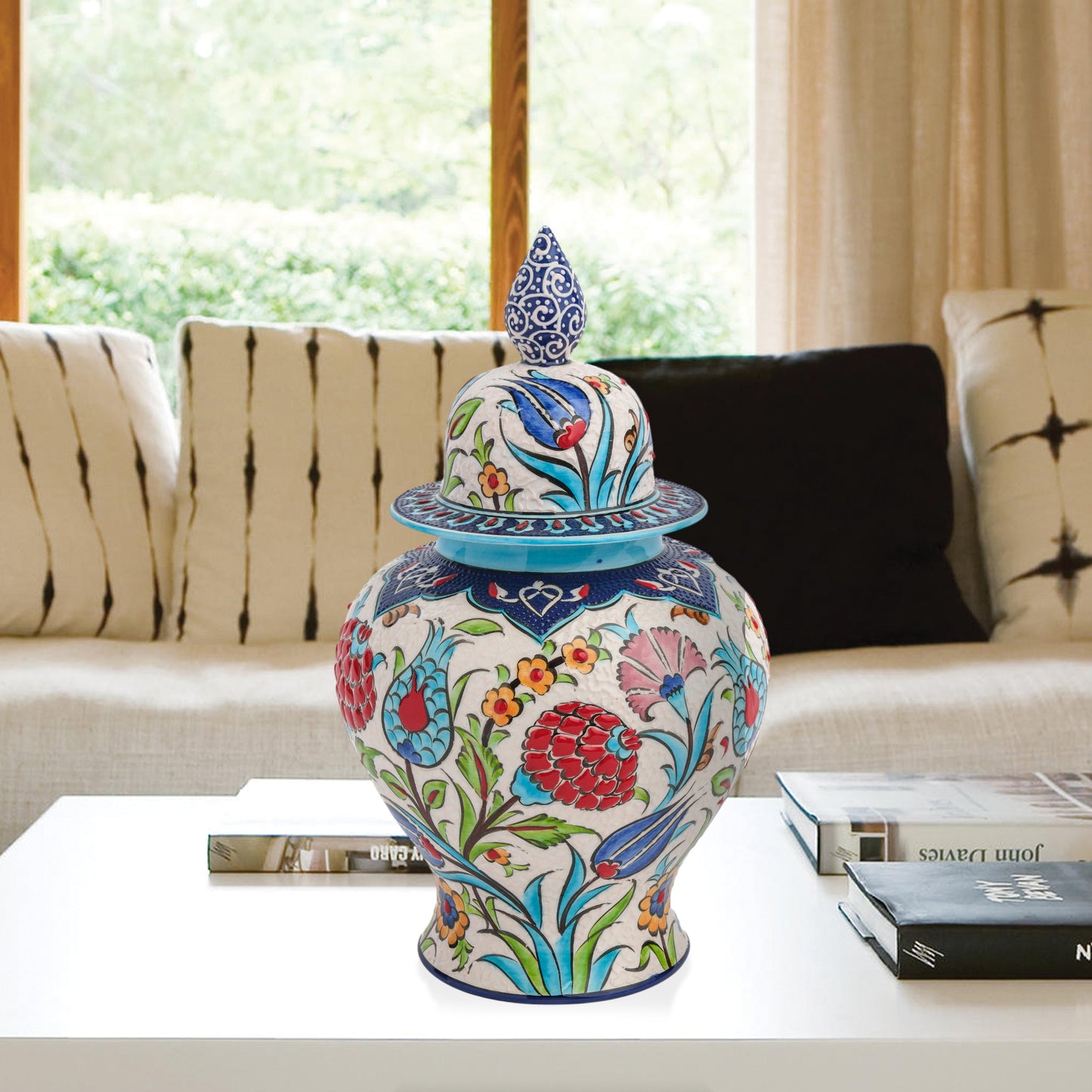 Hand-painted Floral Festival ceramic jar with red carnations, blue tulips & yellow blossoms. Glossy artisan jar with cobalt finial lid, perfect décor or gift.