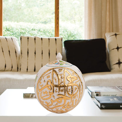 Hand-painted Gold Script globe jar with Arabic calligraphy and turquoise floral motifs. Spherical ceramic design with gold finial, perfect décor or gift.