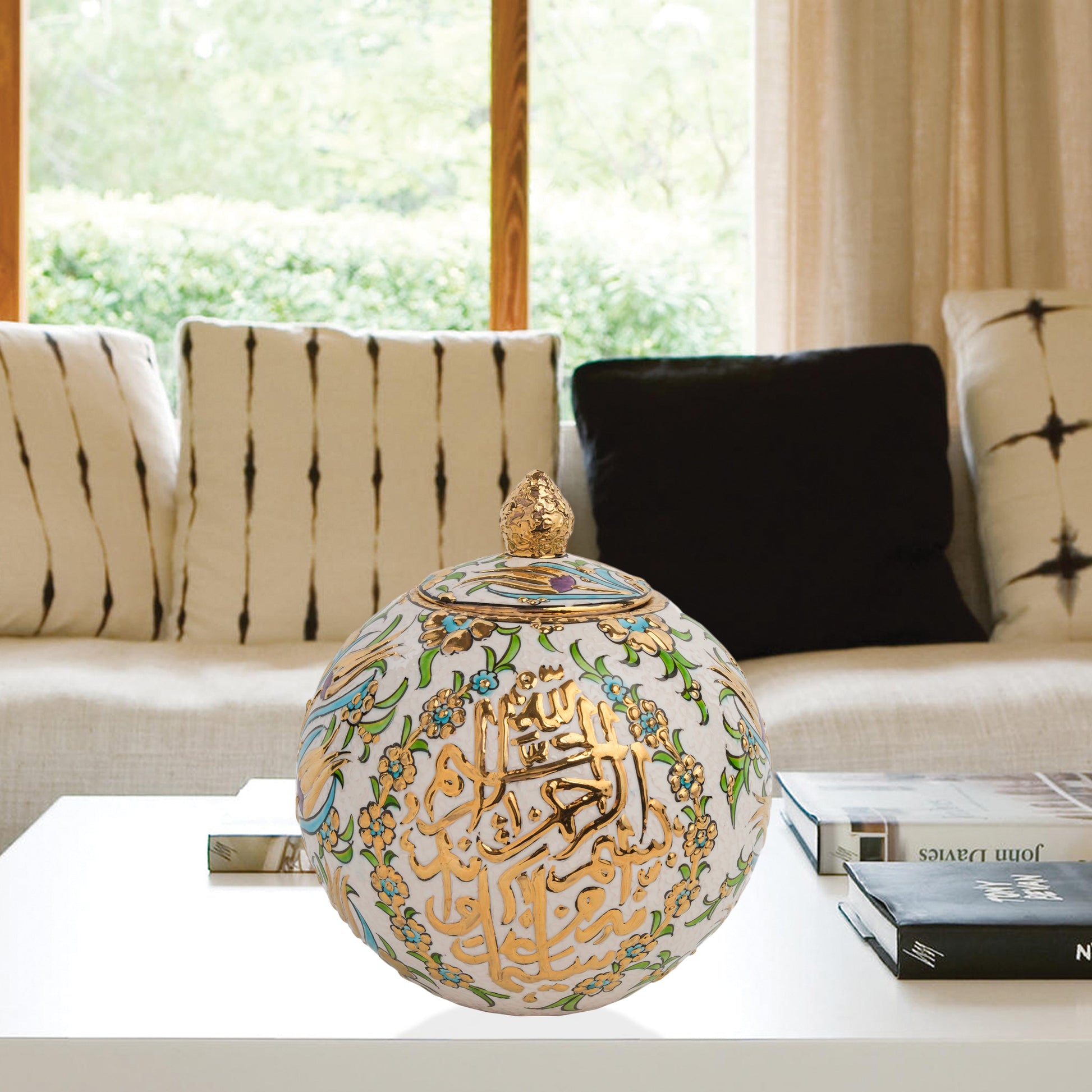 Hand-painted Floral Script globe jar with golden Arabic calligraphy and turquoise floral motifs. Spherical ceramic design, artisan-made, perfect décor or gift.
