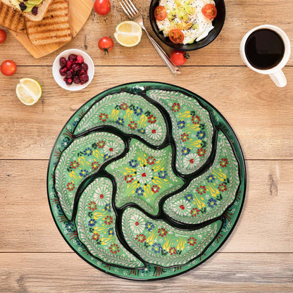 Decorative snack serving tray set with floral patterns on a wooden table with food items.