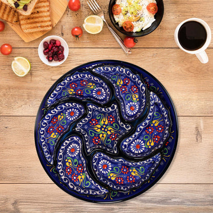 Decorative blue snack serving tray set  with floral patterns on a wooden table with food items.