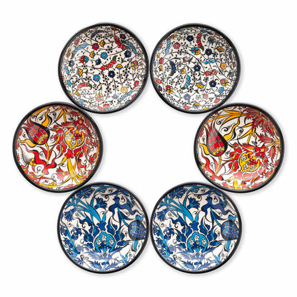 Set of six ceramic pinch bowls with colorful floral and abstract designs on a white background
