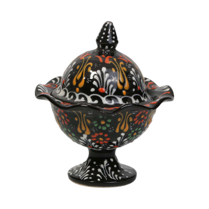 Decorative ceramic sugar bowl with a lid on a white background