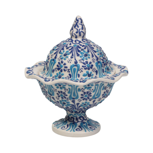 Ceramic sugar bowl with blue and white floral pattern on a white background