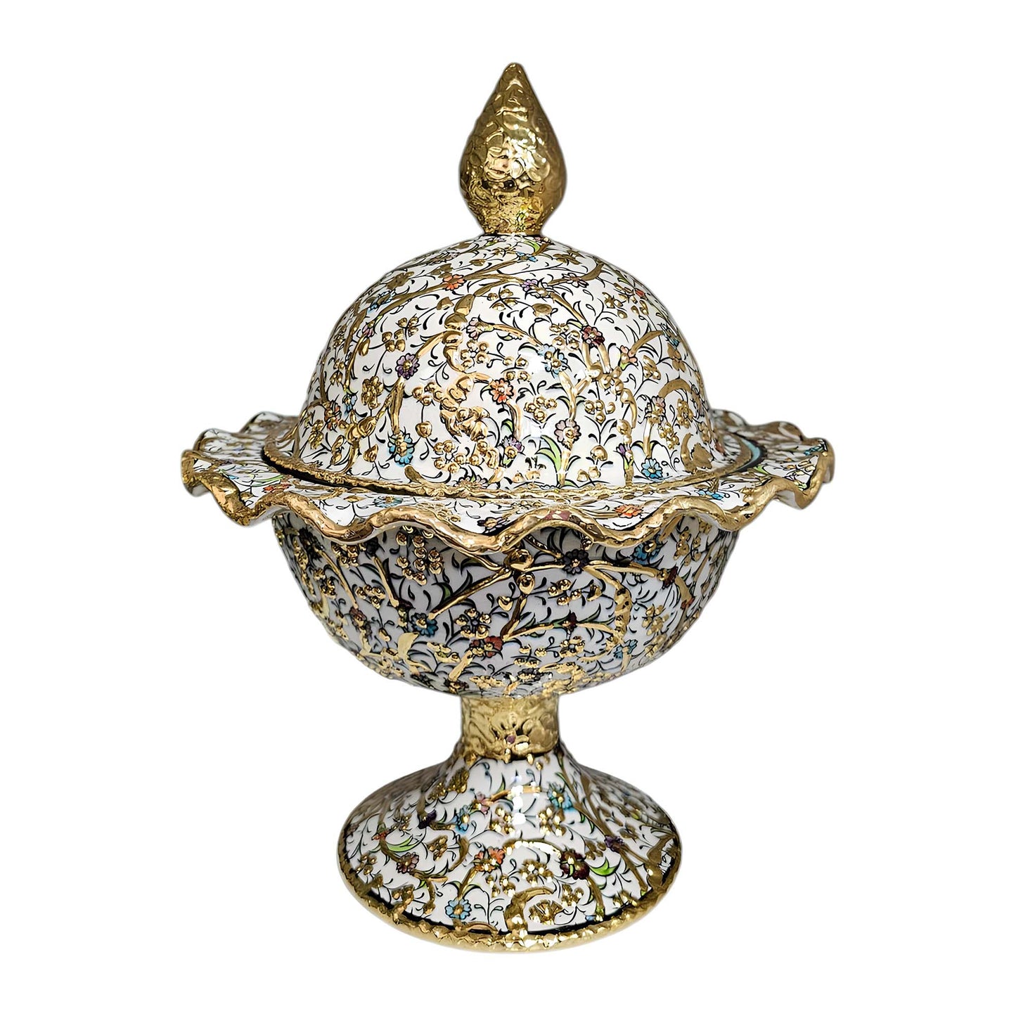 Decorative sugar bowl with intricate gold and white design on a white background