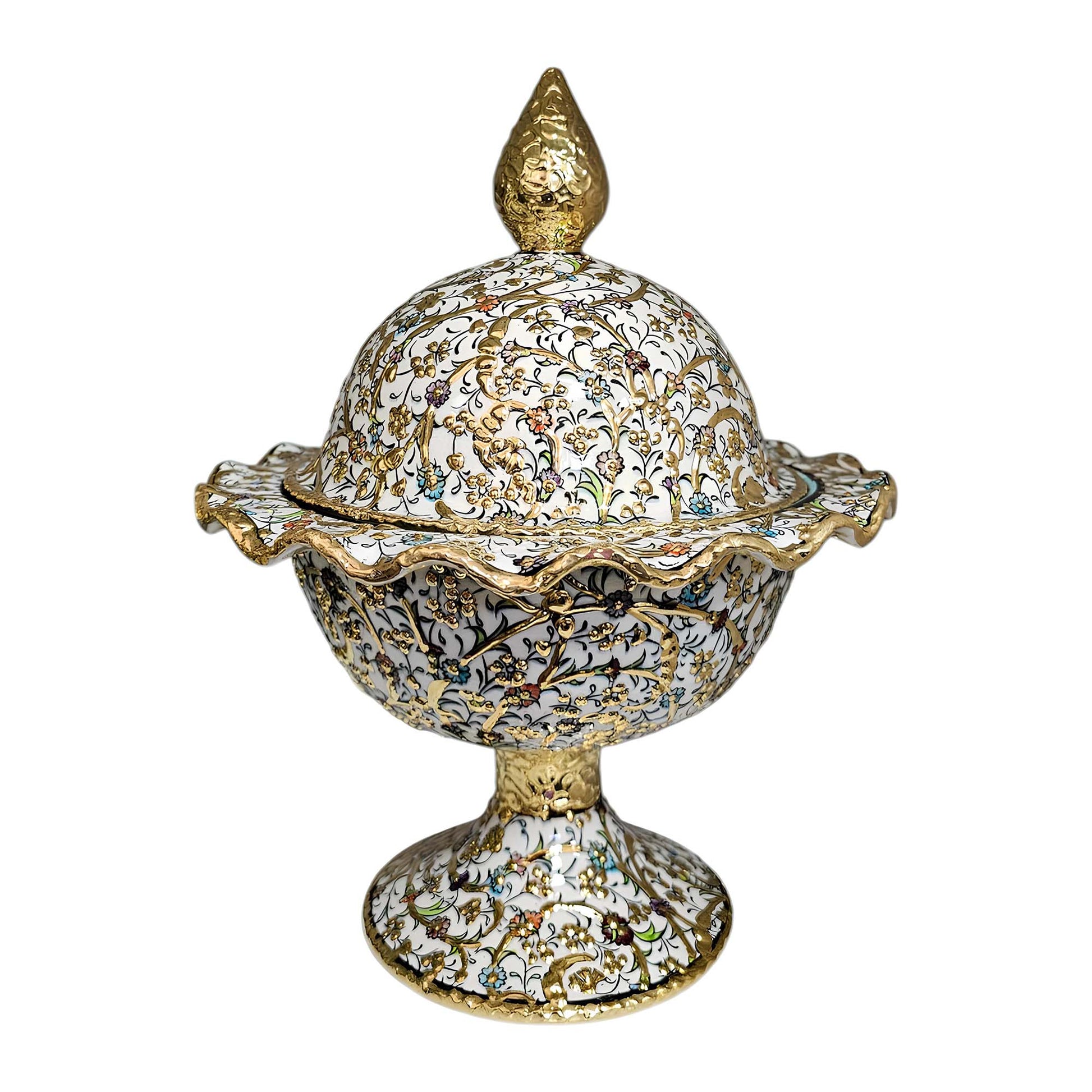Decorative sugar bowl with intricate gold and white design on a white background