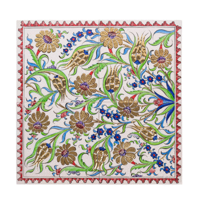 A handmade ceramic tile with a classical Ottoman floral pattern featuring gold-accented flowers, surrounded by a decorative border.