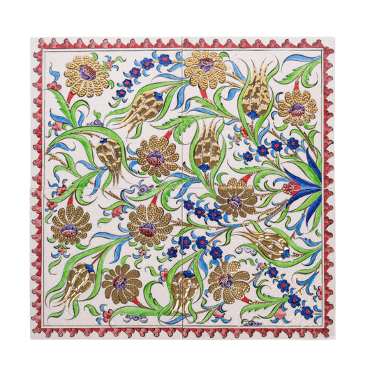 A handmade ceramic tile with a classical Ottoman floral pattern featuring gold-accented flowers, surrounded by a decorative border.