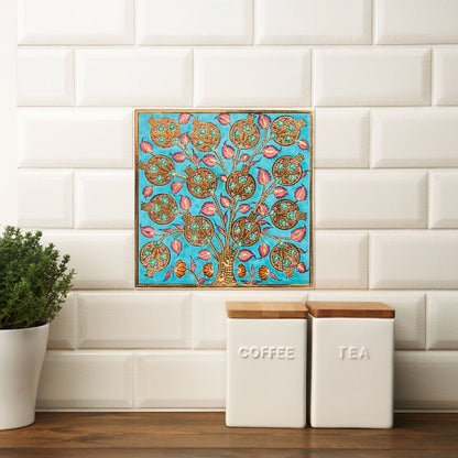 Decorative ceramic tile above kitchen storage jars with a plant and tiled wall background.