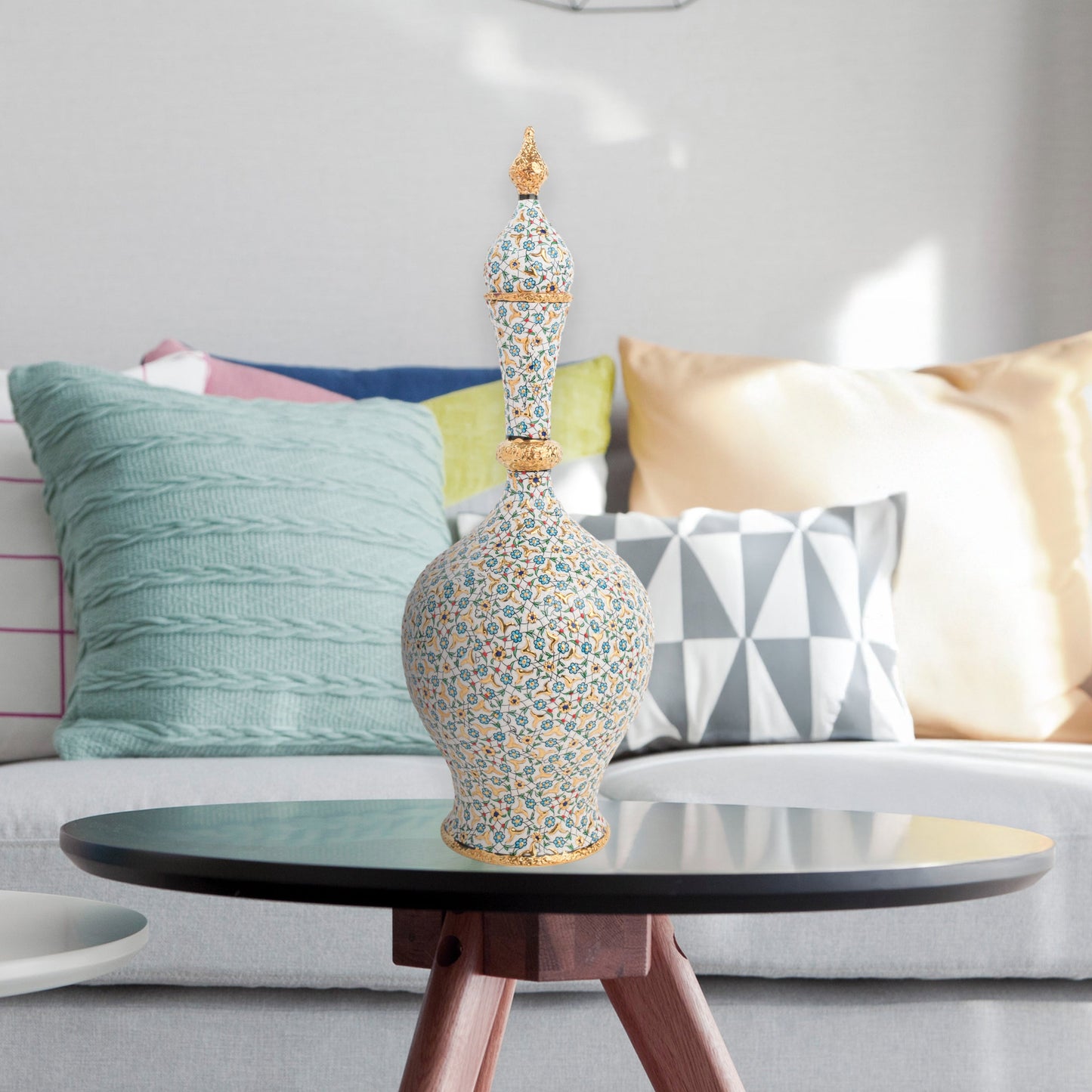 Hand-painted ceramic decorative bottle with turquoise floral motifs and golden details. Minaret-inspired shape with spire lid, perfect for décor or gifting.