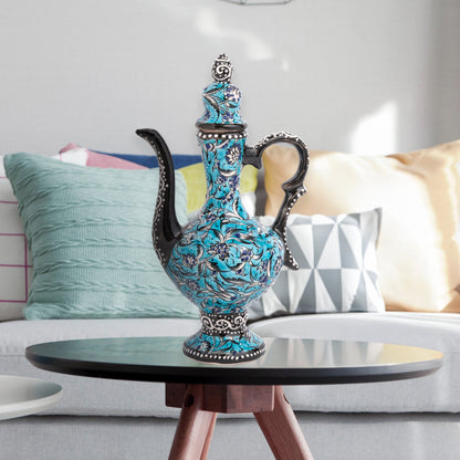 Hand-painted turquoise Ottoman-style ceramic ewer with floral motifs, curved spout & sculptural handle. Decorative artisan piece, perfect décor or gift.