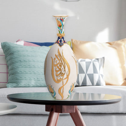 Hand-painted ceramic decorative bottle with golden Arabic calligraphy on ivory, accented with floral motifs. Glossy artisan vase, perfect for décor or gifts.
