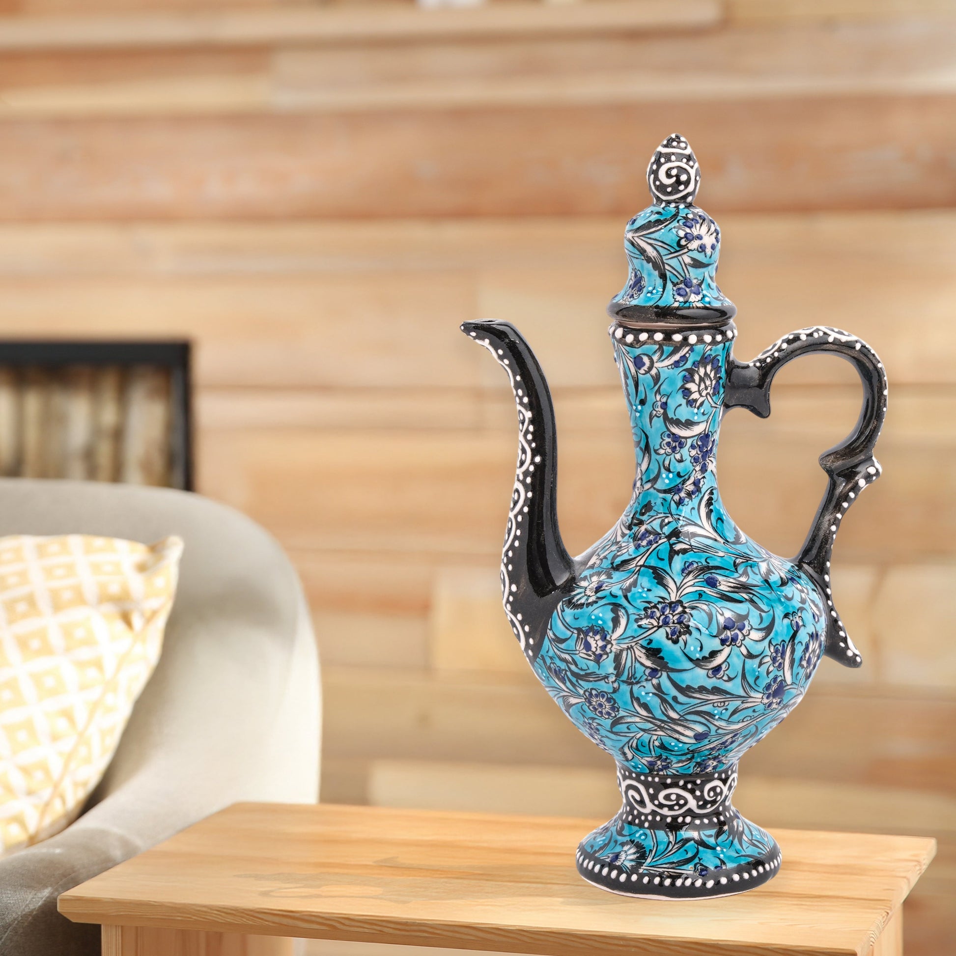 Hand-painted turquoise Ottoman-style ceramic ewer with floral motifs, curved spout & sculptural handle. Decorative artisan piece, perfect décor or gift.
