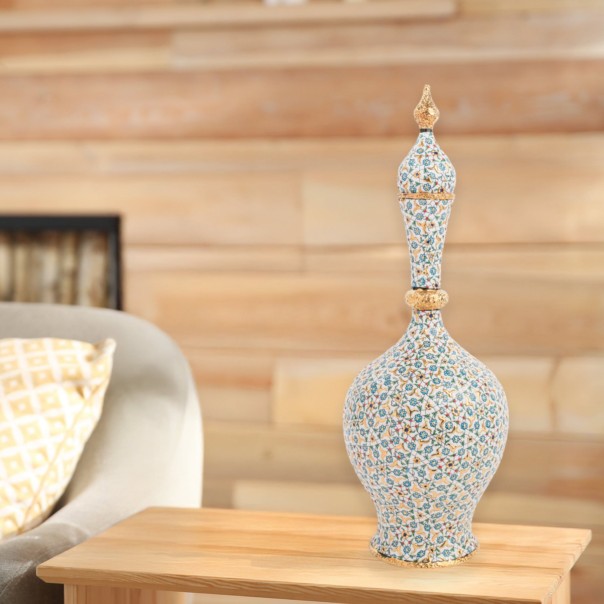 Hand-painted ceramic decorative bottle with turquoise floral motifs and golden details. Minaret-inspired shape with spire lid, perfect for décor or gifting.