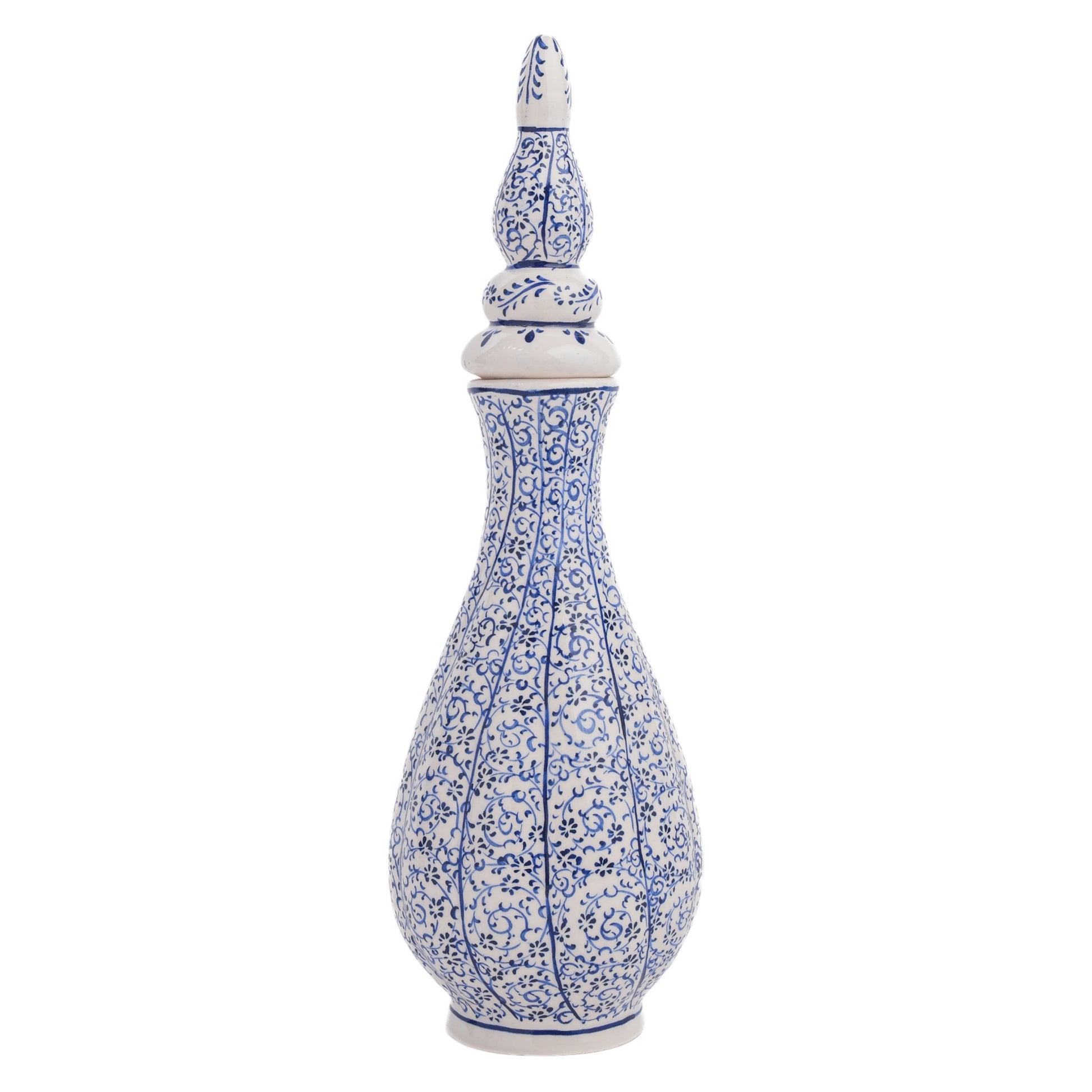A tall, hand-painted Turkish ceramic vase with a white base and blue floral vine motif, featuring a pointed lid.
