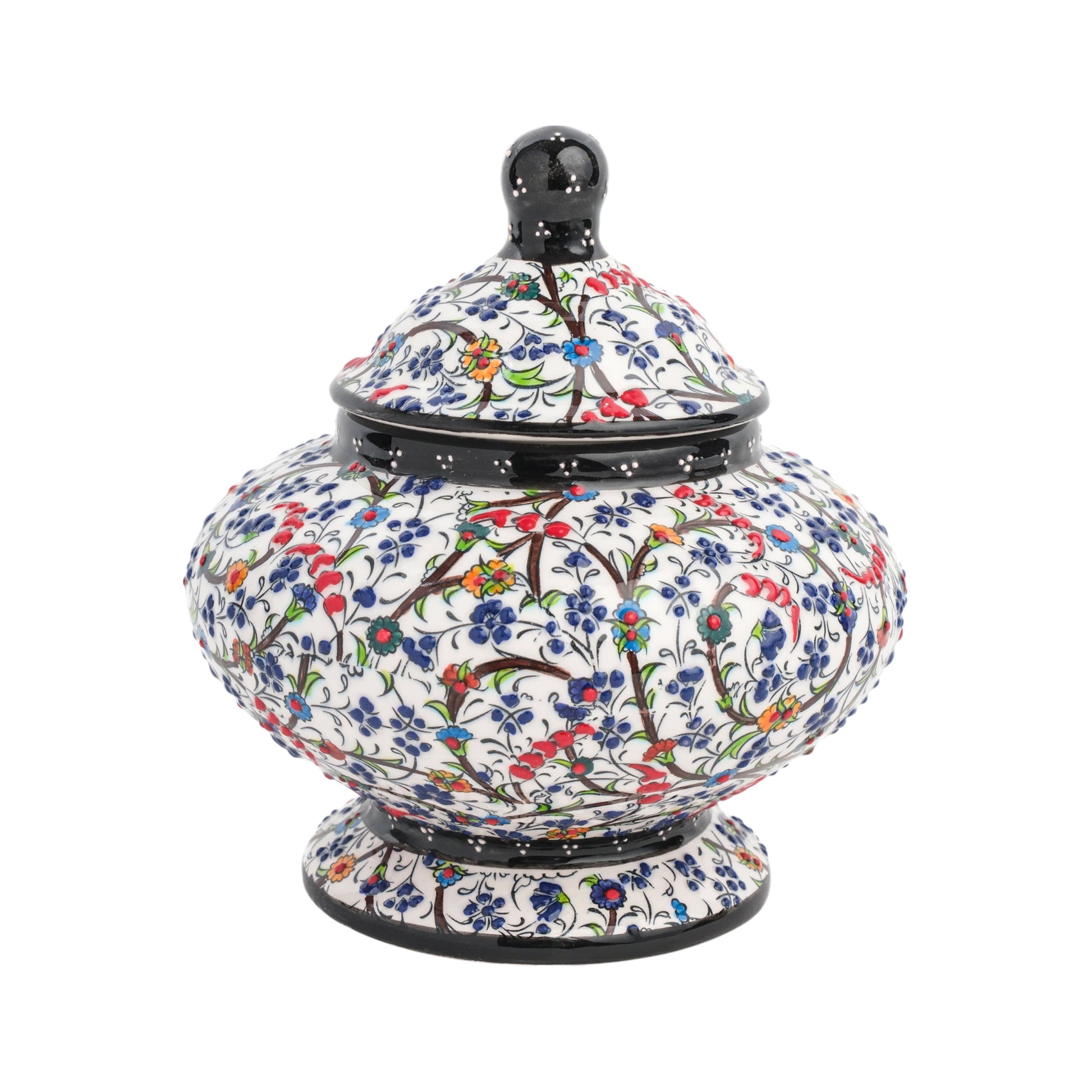 Handmade ceramic jar with a floral meadow design, featuring a lid, in a glossy finish.