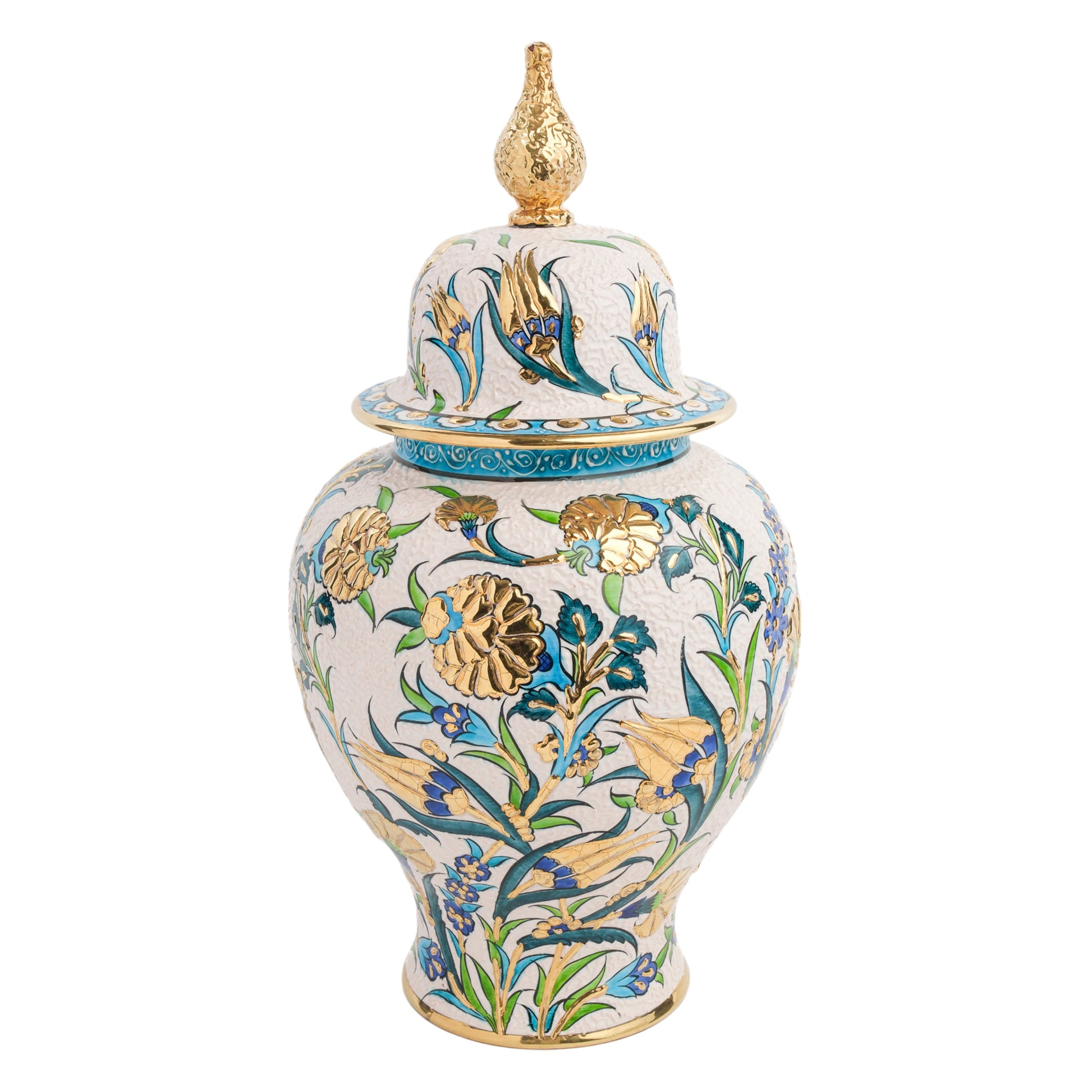 A hand-painted ceramic jar with a golden finial on the lid, featuring a blue and green floral motif with gold detailing.