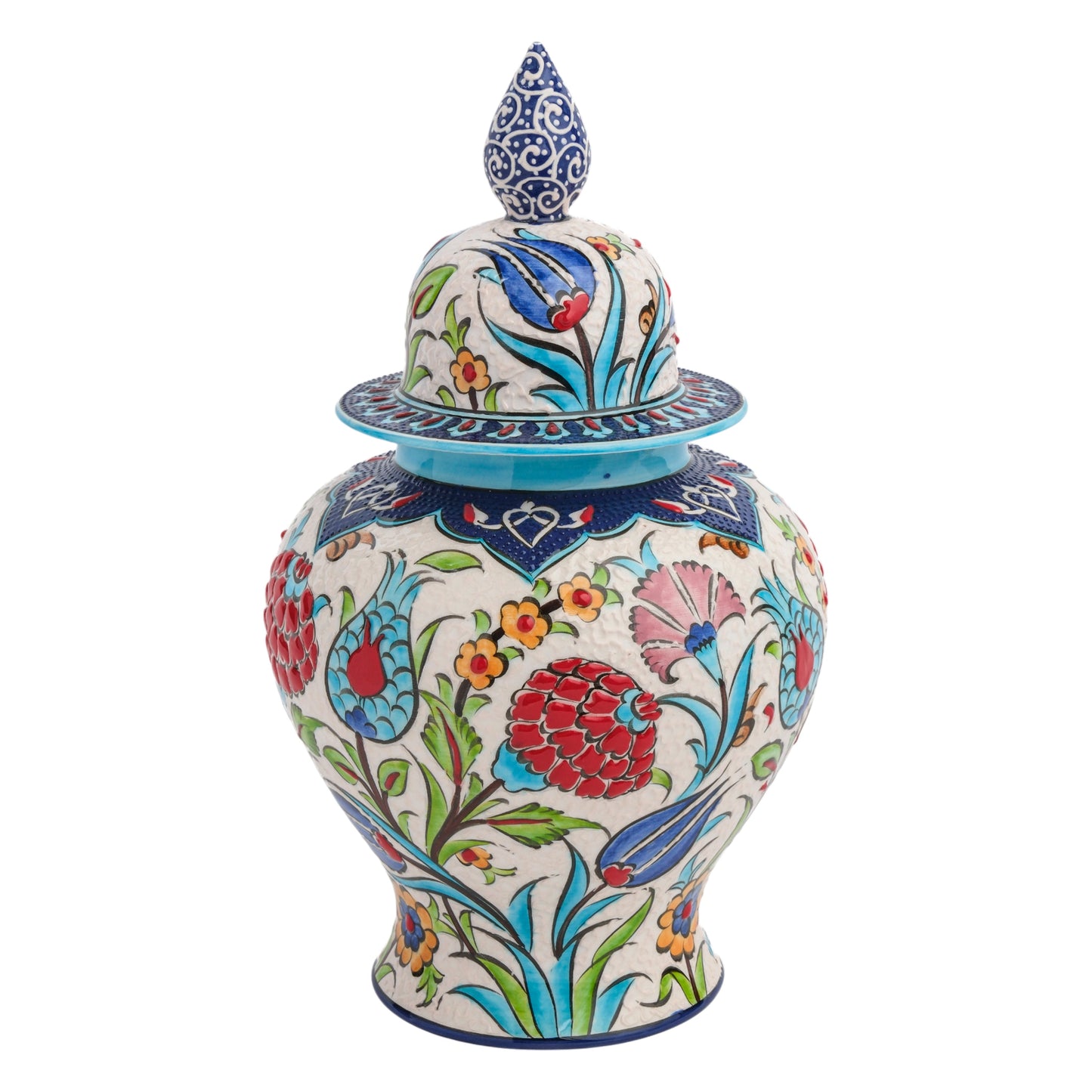 A hand-painted ceramic jar with a floral festival design, featuring red carnations, blue tulips, and yellow blossoms, and a blue ornate lid with a cobalt finial.
