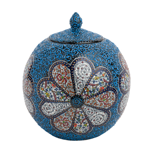 A handmade ceramic decorative jar with a blue blossom floral pattern and a lid, featuring intricate blue scrollwork on a matte-textured base.