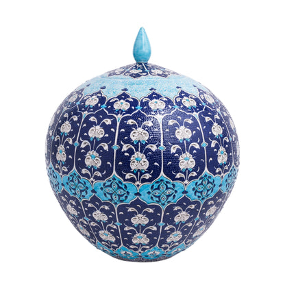 A hand-painted ceramic jar with a floral pattern in Ottoman blue and white colors, featuring a pointed lid finial.