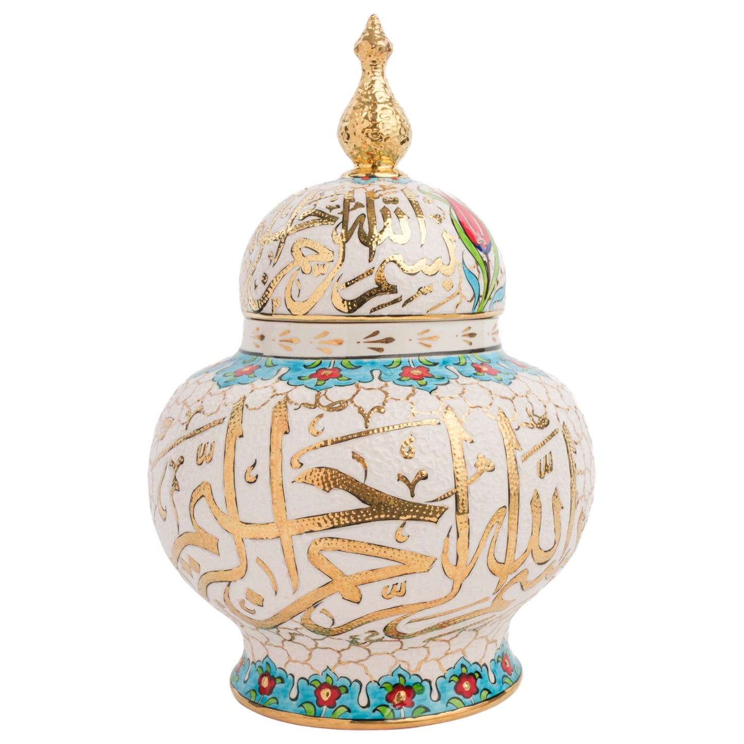 A handmade ceramic jar with a lid, featuring hand-painted Islamic calligraphy in gold, with turquoise and red floral accents, and a gold finial on the lid.