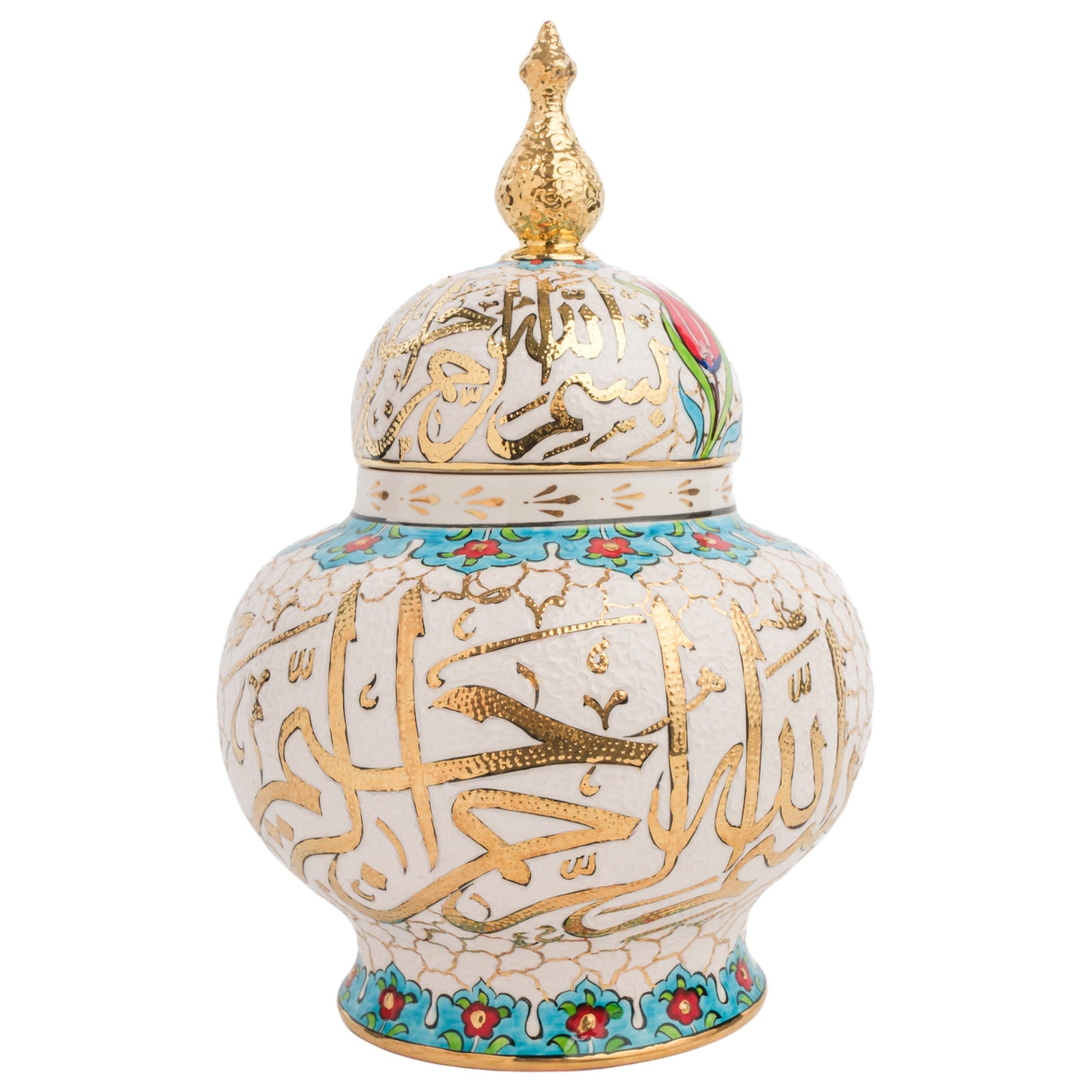 A handmade ceramic jar with a lid, featuring hand-painted Islamic calligraphy in gold, with turquoise and red floral accents, and a gold finial on the lid.