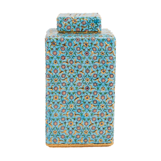 A turquoise ceramic square jar with a hand-painted golden blossom decorative pattern and a matching lid.