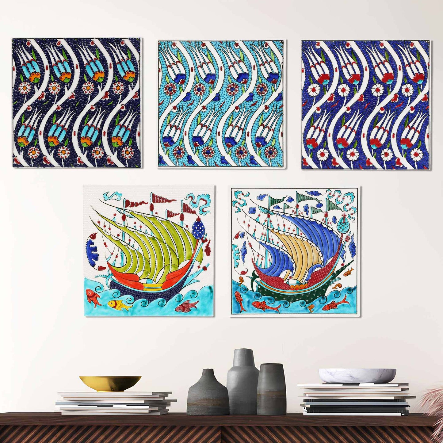 Set of colorful ceramic tiles on a wall above a wooden shelf with decorative items.