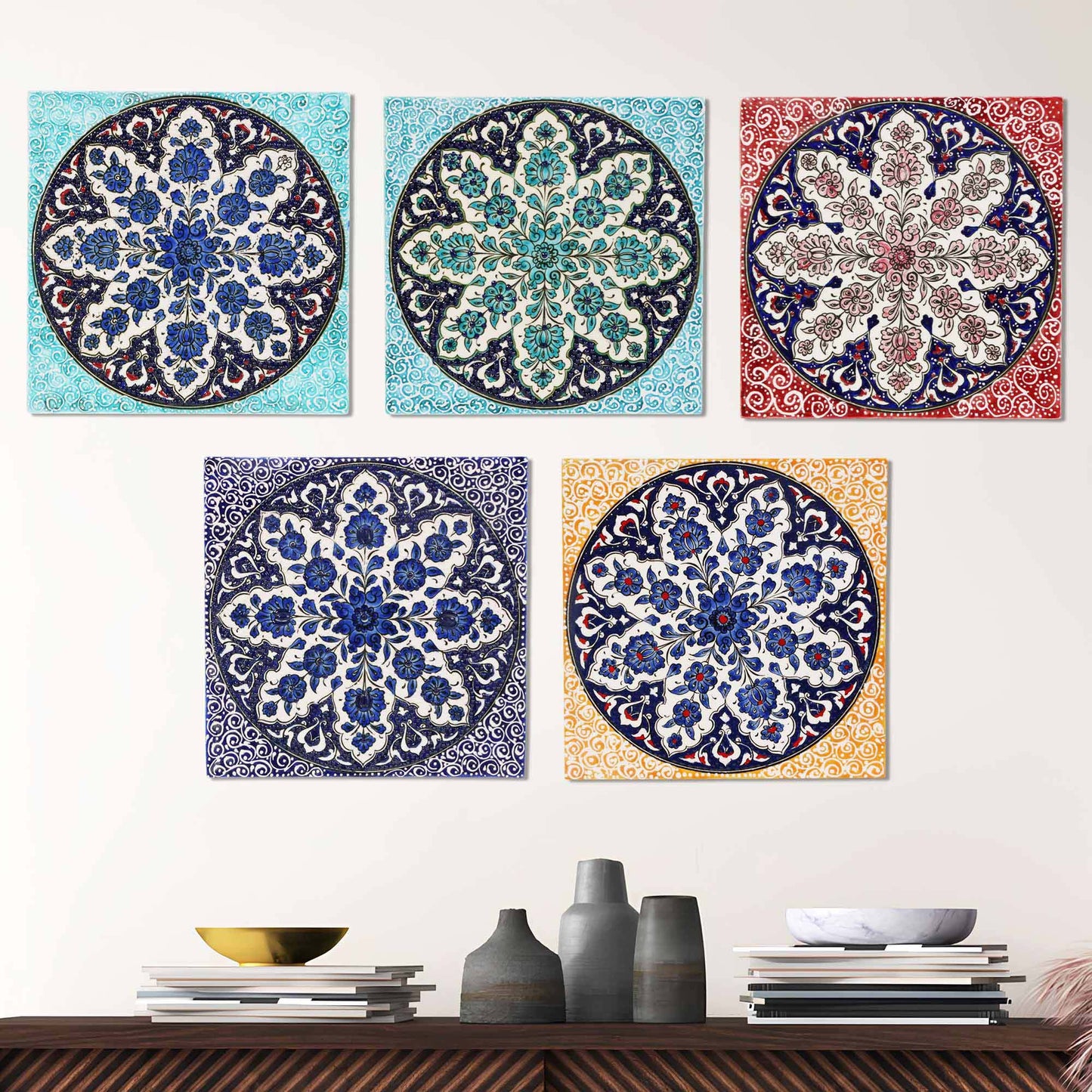 Decorative ceramic tiles with floral patterns on a white wall.