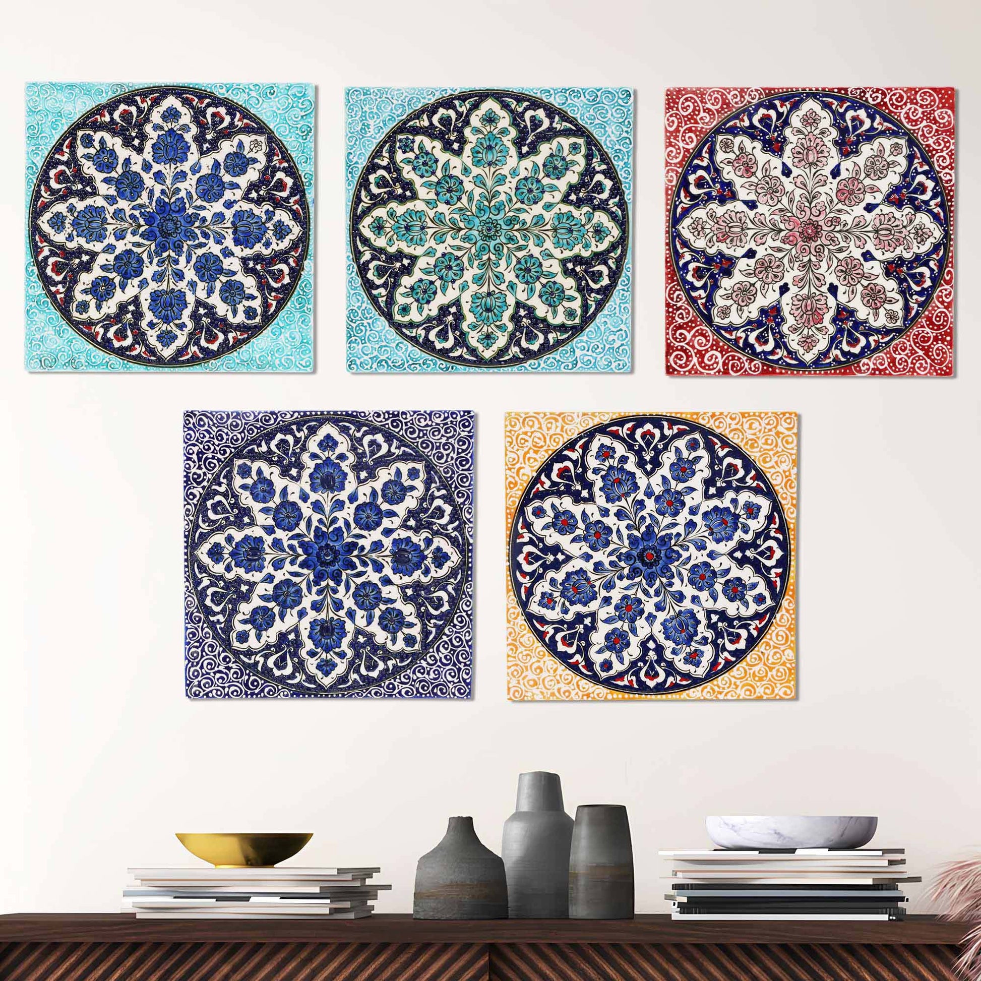 Decorative ceramic tiles with floral patterns on a white wall.