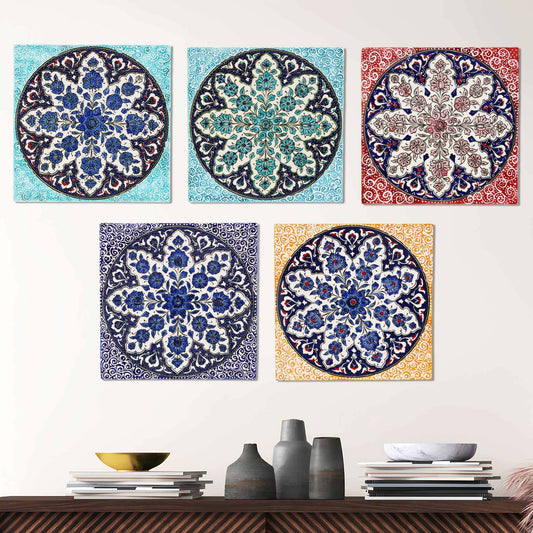 Decorative ceramic tiles with floral patterns on a white wall.