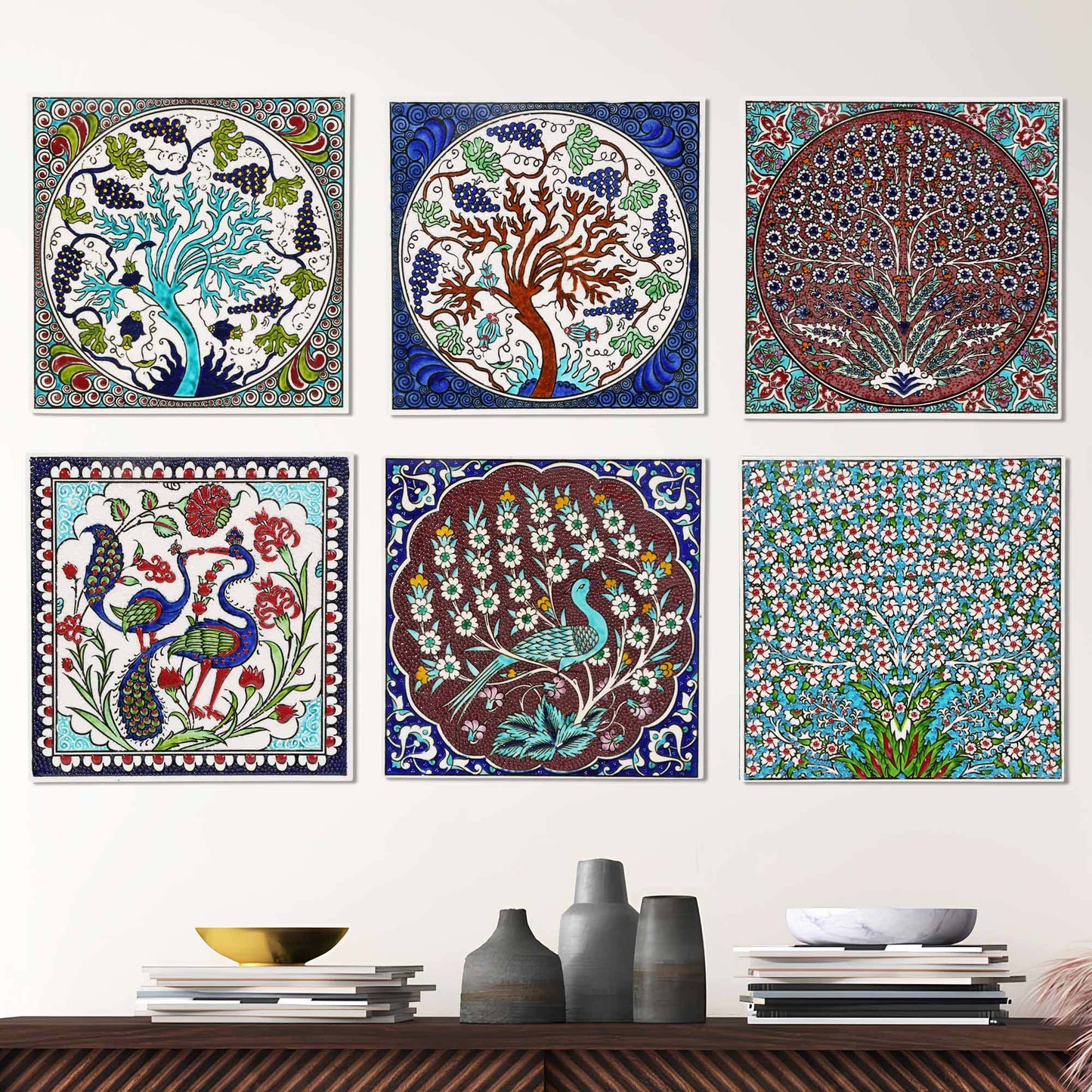 Colorful ceramic tile wall art featuring nature-themed designs on a white wall.