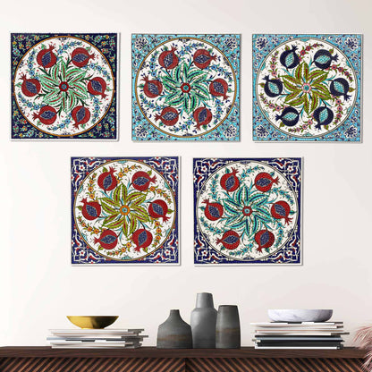 Colorful floral and pomegranate designs ceramic tiles on a wall above a wooden shelf with decorative items.