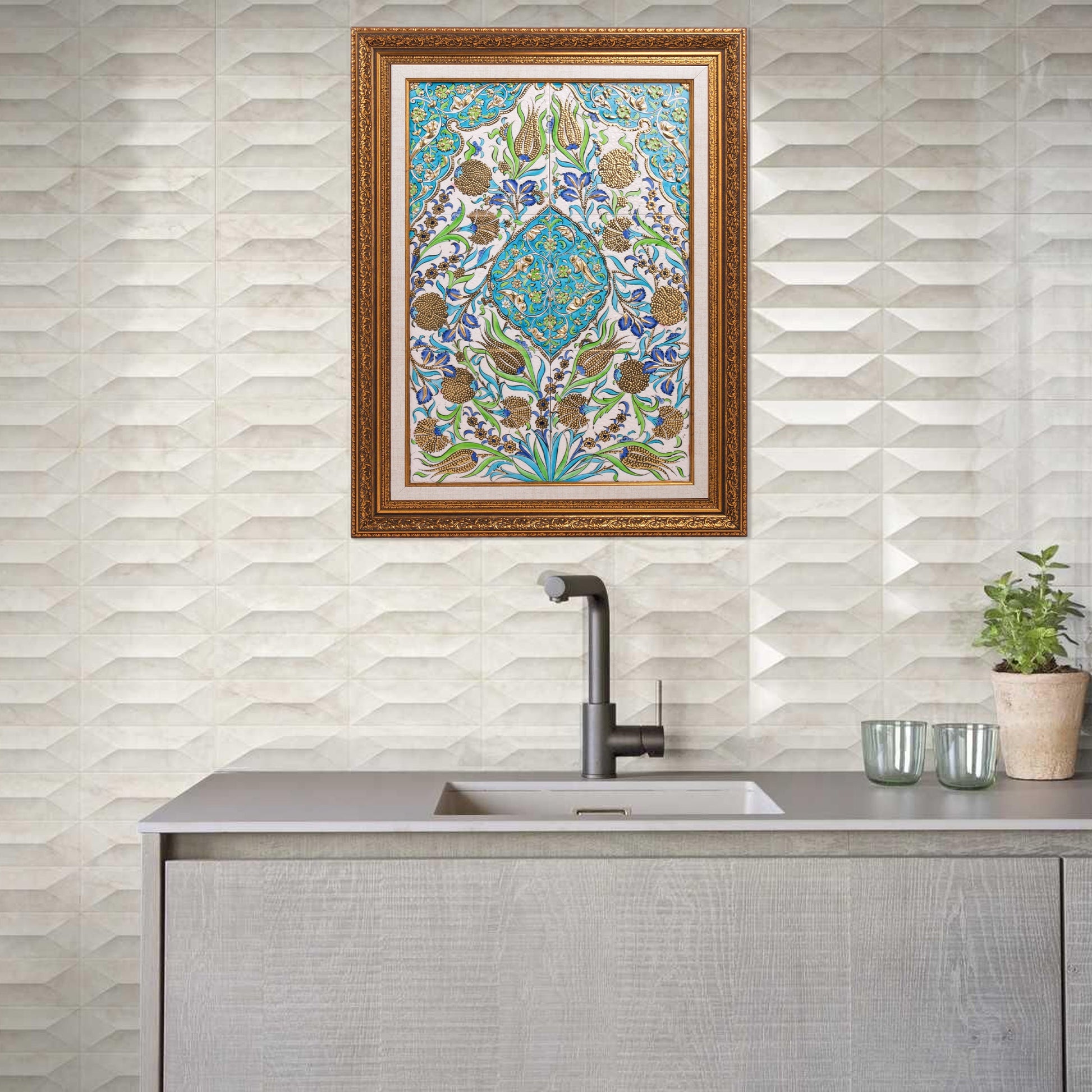 Decorative kitchen with patterned ceramic tile and framed artwork above a sink.