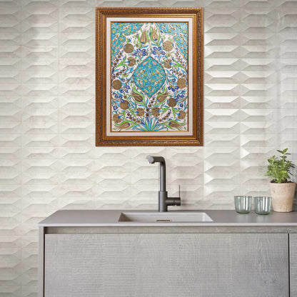 Decorative kitchen with patterned ceramic tile and framed artwork above a sink.