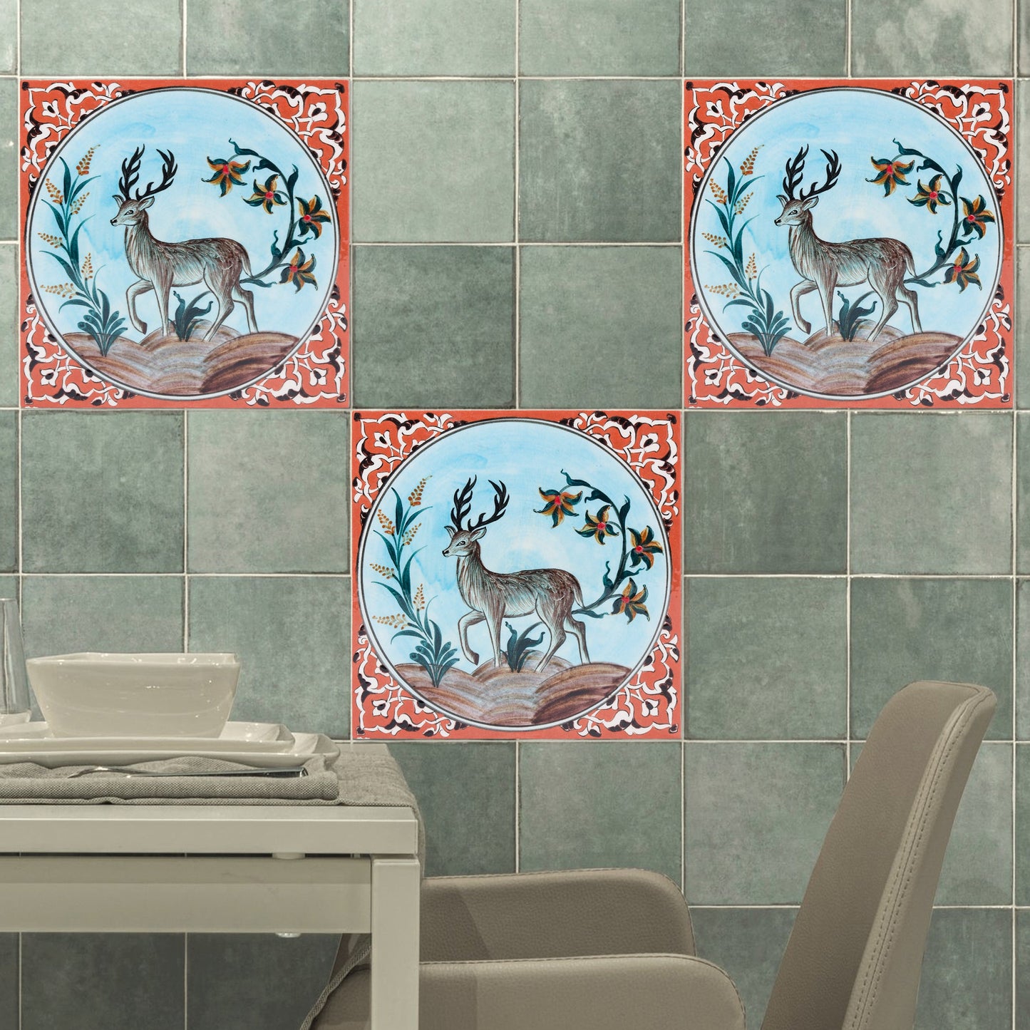 Decorative ceramic tiles with deer design on a tiled wall.