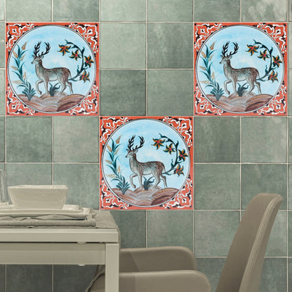 Decorative ceramic tiles with deer design on a tiled wall.