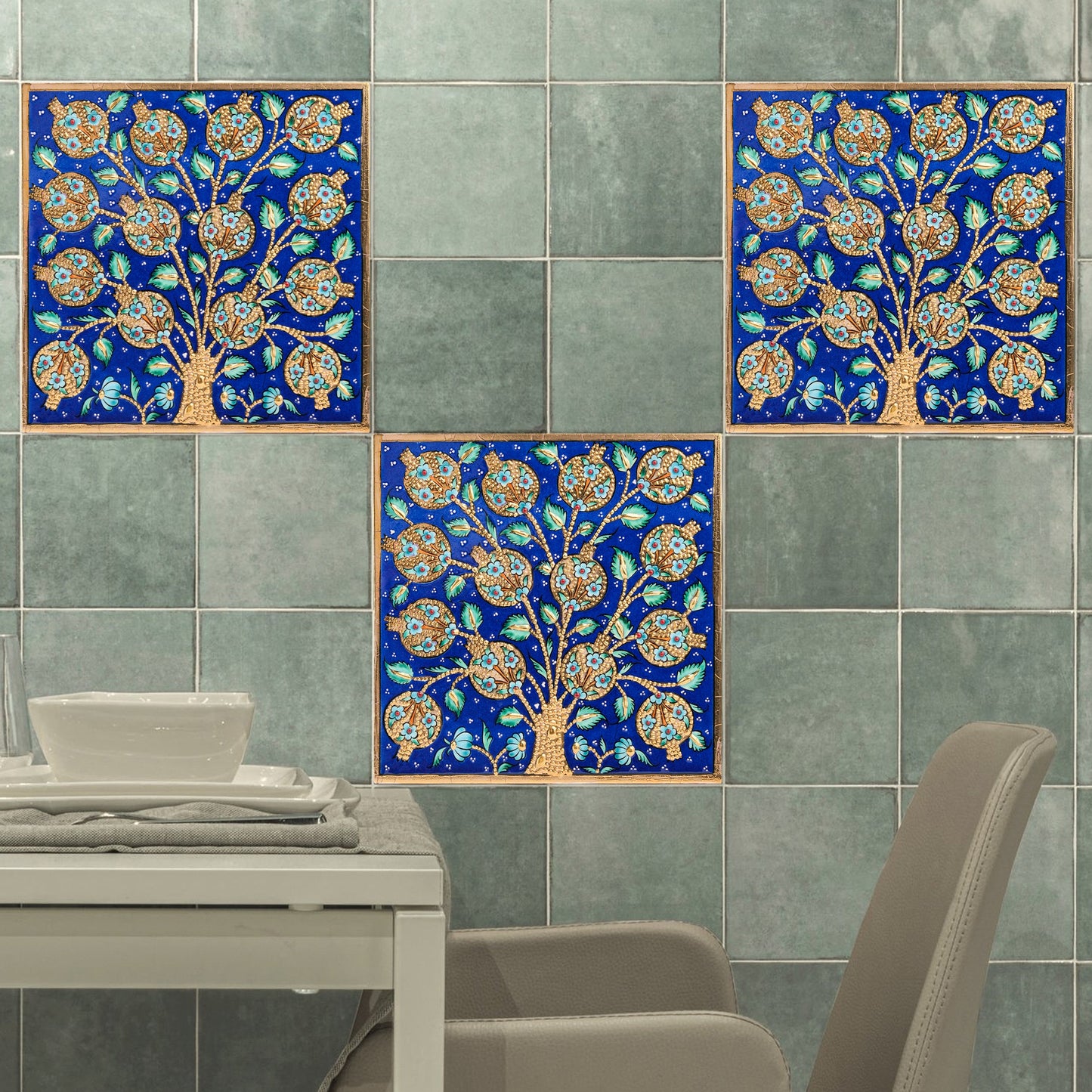 Decorative ceramic tiles with tree design on green tiles.
