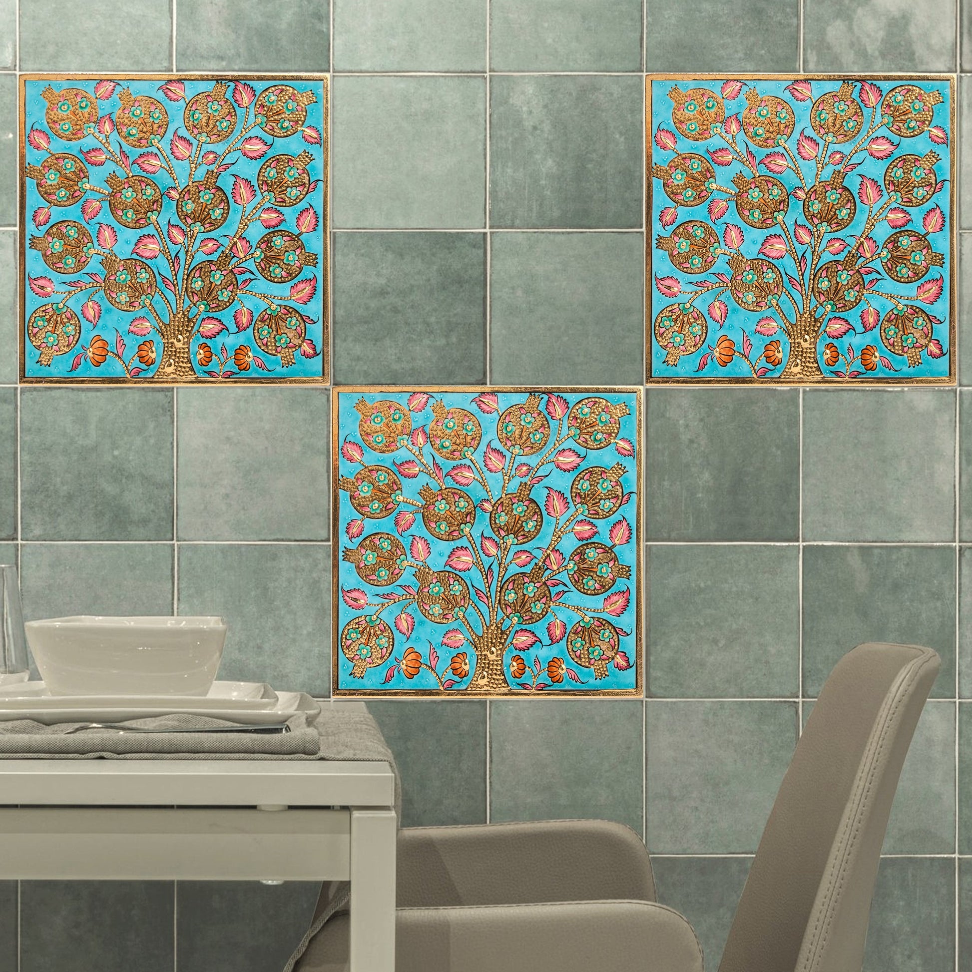 Decorative ceramic tiles on a wall in a dining area.