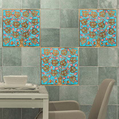 Decorative ceramic tiles on a wall in a dining area.