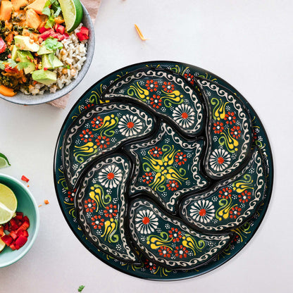 Decorative snack serving tray set with colorful patterns on a white surface with bowls of food.