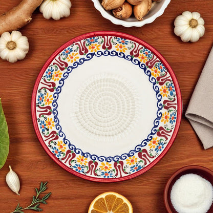 Decorative garlic grater bowl with colorful on a wooden table with ingredients