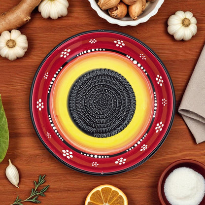 Decorative garlic grater bowl with a central Oreo cookie on a wooden surface with autumn-themed items.