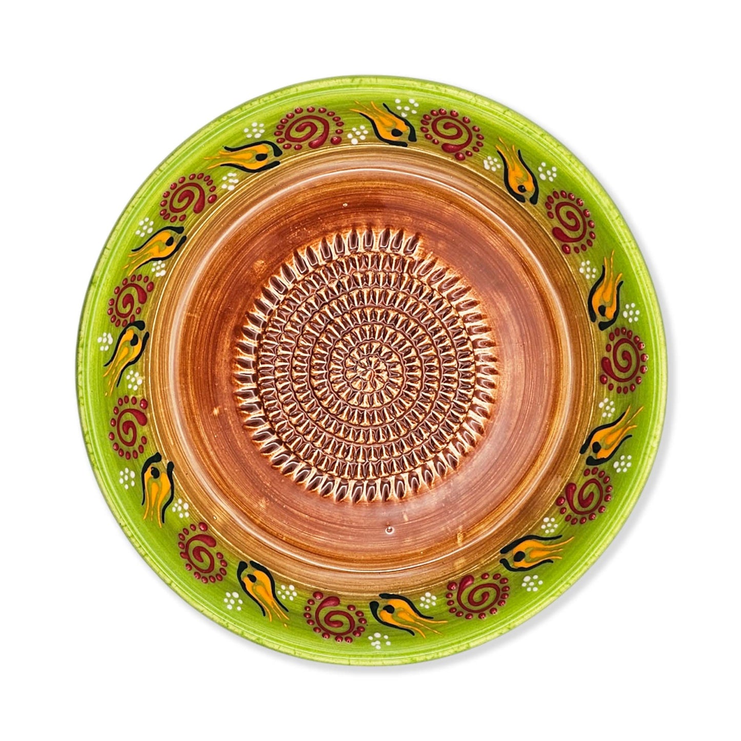 Ceramic garlic grater bowl with decorative green rim and brown center on a white background