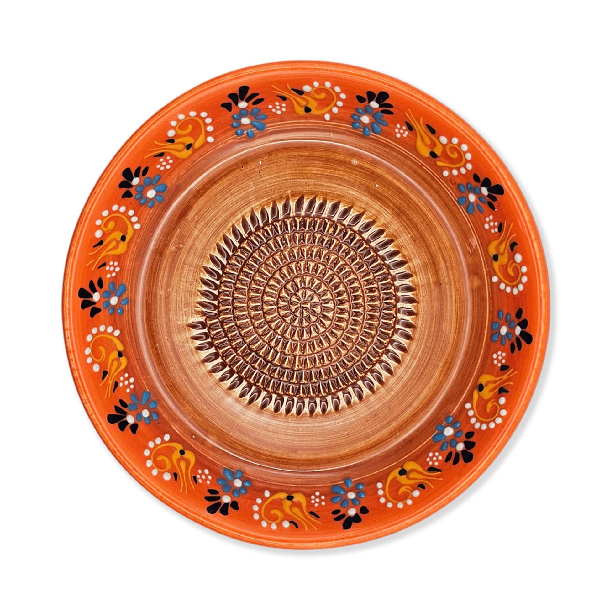 Decorative ceramic garlic grater bowl with orange rim and intricate patterns on a white background