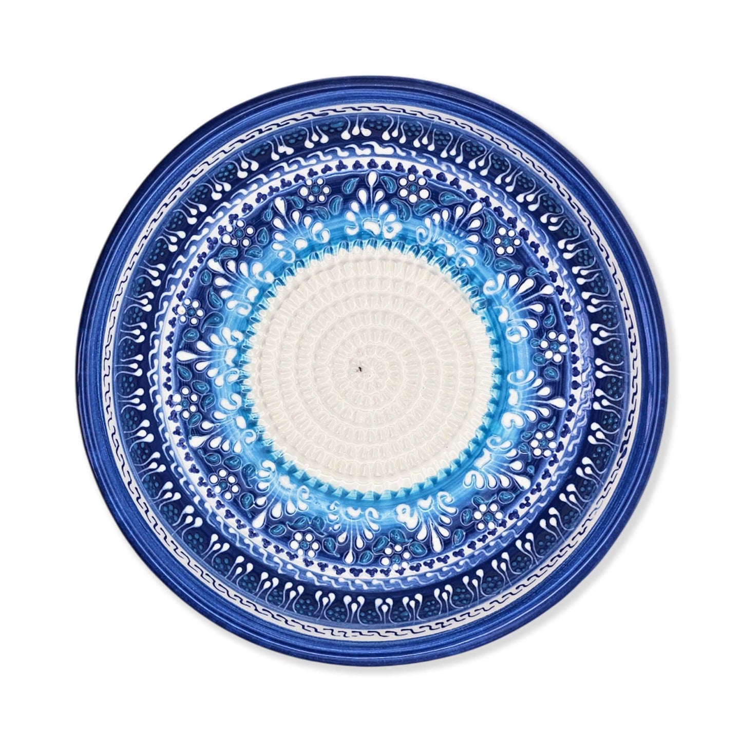 Decorative garlic grater bowl with blue and white pattern on a white background