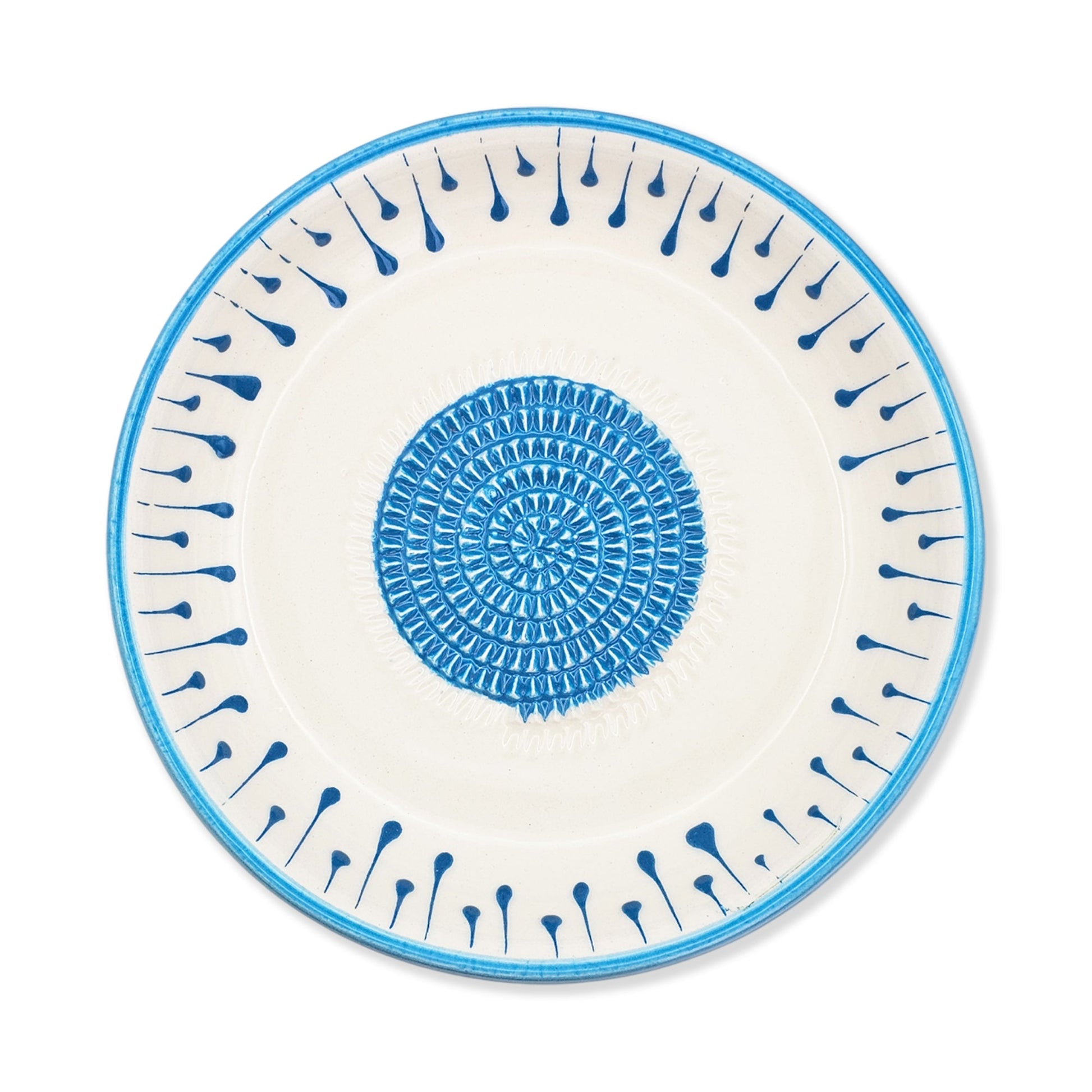 Ceramic garlic grater bowl with blue decorative pattern on a white background
