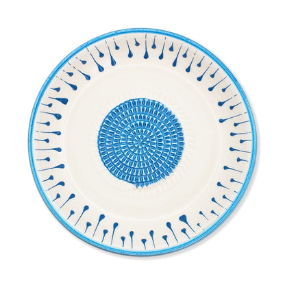 Ceramic garlic grater bowl with blue decorative pattern on a white background