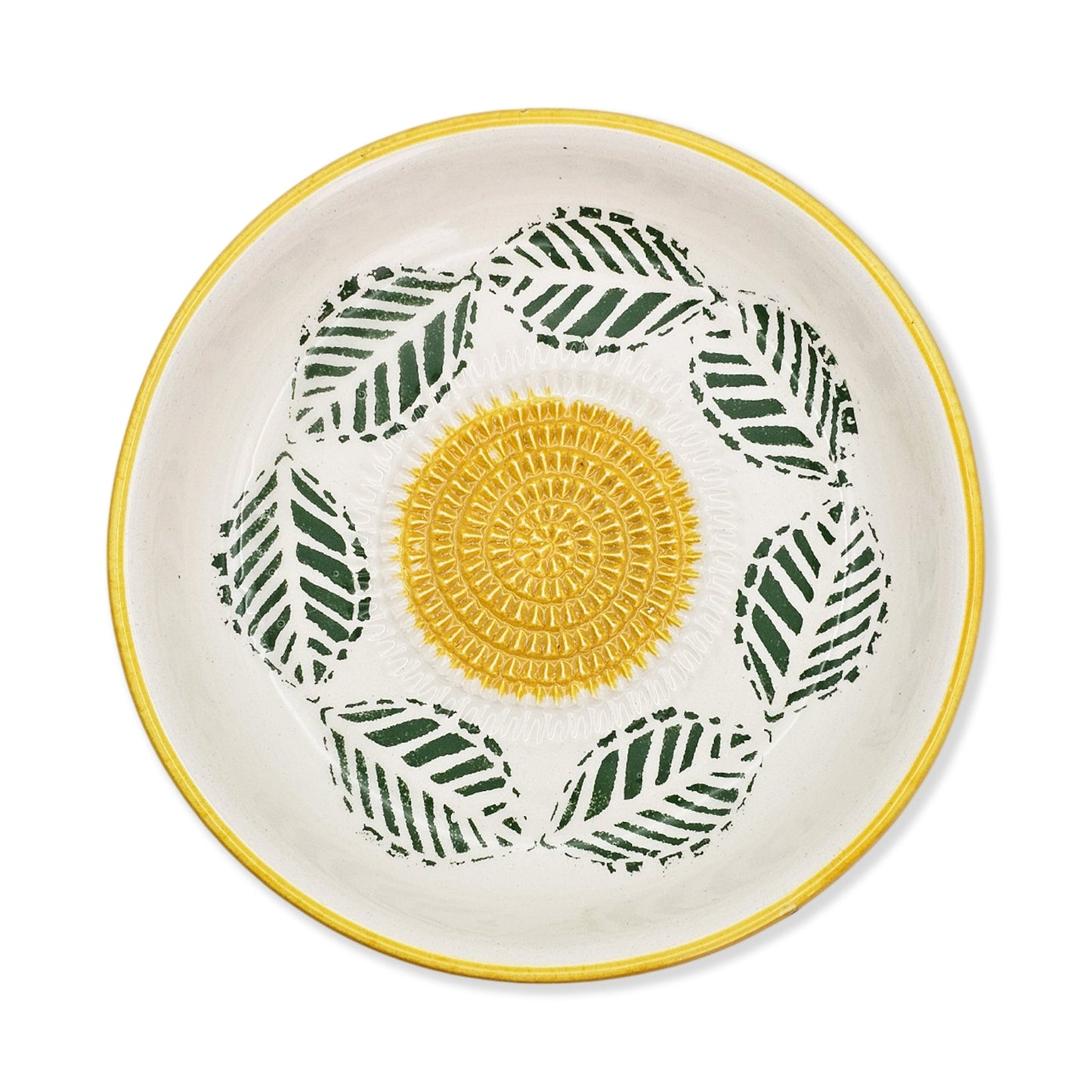 Ceramic garlic grater bowl with yellow center and green leaf patterns on a white background