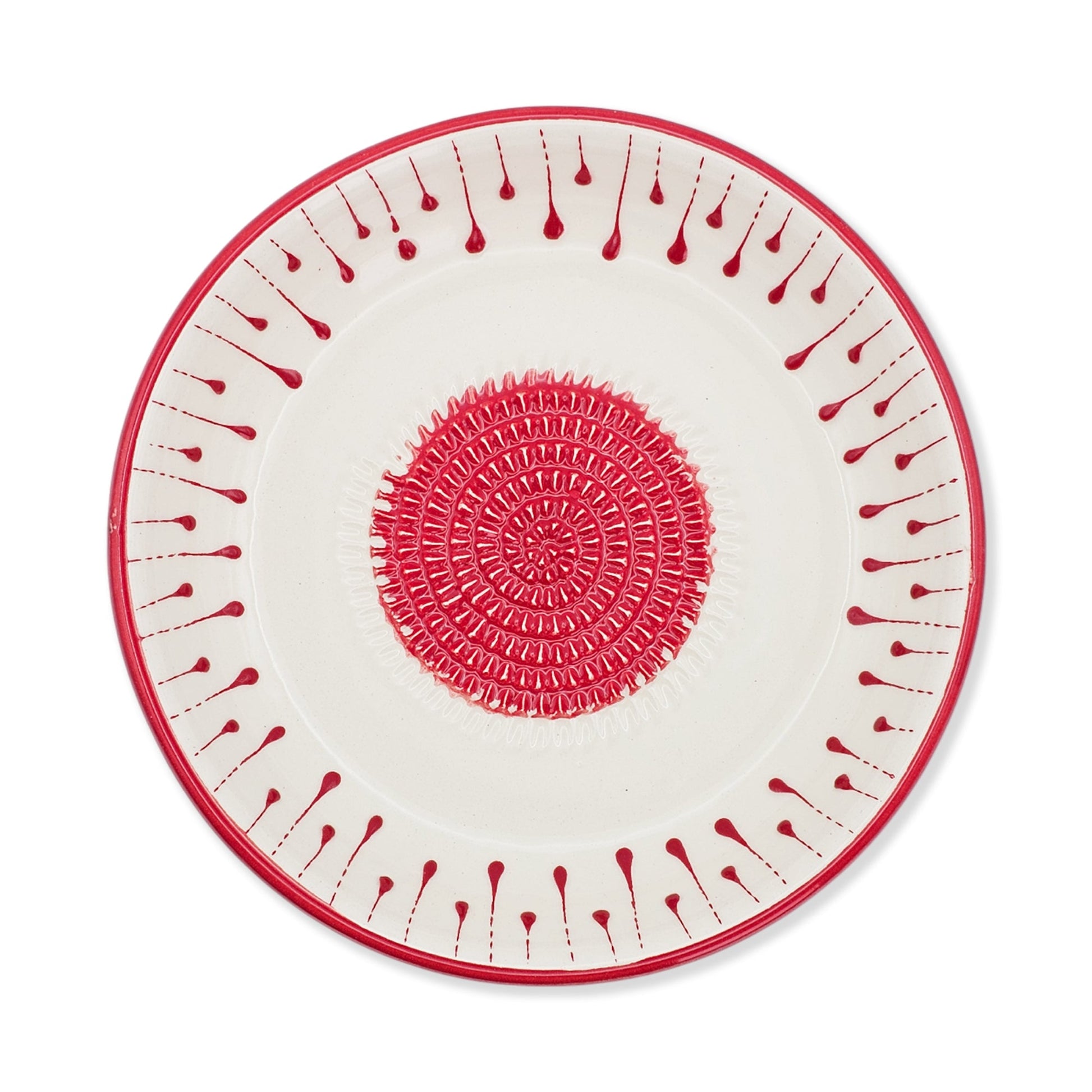 Decorative garlic grater bowl with red and white pattern on a white background